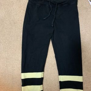 BLACK “YEAR OF OURS” JOGGERS WITH YELLOW STRIPES